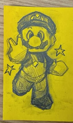 a drawing of a cartoon character on yellow paper