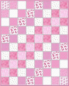 a pink and white quilt with hearts on it