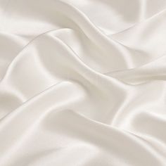 Type: 16momme Silk Charmeuse Fabric Thickness: 16m/m, about 68g per square meter Fabric Width: 114cm （44inches) Content: 100% silk Color: Off White Silk Charmeuse Fabric not only the finest aesthetics, but retains the fluid sophistication most sought after in silk fabrics. Charmeuse is lightweight and drapes naturally. It has a satin side, which is shiny, and a matte side, which is dull and looks crepe. Silk charmeuse is more expensive and delicate but is softer and a better insulator. Which we Satin Fabric Images, Brilliant White Fabric, Luxury White Silk Evening Dress, Silk White Blanket, Whitw Satin Wallpaper, Satin Wallpaper Silk Beige, Luxury Elegant White Tulle Fabric, White Silk Blanket Wallpaper, Luxury White Silk Embroidered Fabric