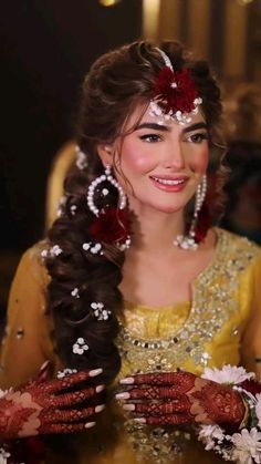 a woman with long hair and flowers in her hair