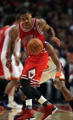 a basketball player dribbling the ball during a game