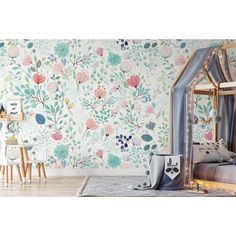 a child's bedroom decorated in floral wallpaper