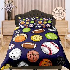 a bed covered in a purple comforter with lots of different sports balls on it