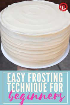 a white frosted cake with the words easy frosting technique for beginners