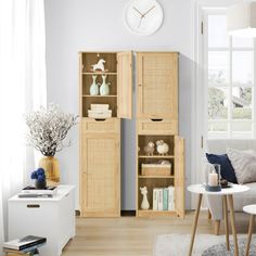 a living room filled with furniture and a clock on the wall above it's doors