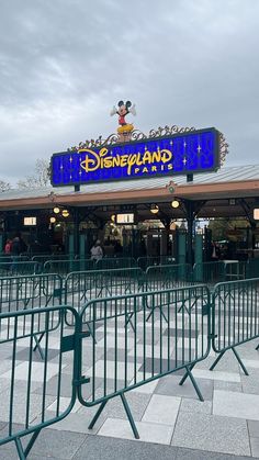 the entrance to disneyland land is blue and yellow