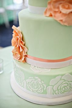 a three tiered cake with flowers on it