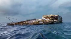 a boat in the water with it's front end on top of another boat