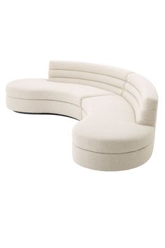 the curved sofa is white and has no cushions on it's back end, as well as an ottoman