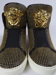 New in box men’s sneakers by VERSACE in size EU 41 (approximate US size 8). Fabulous black leather high top sneakers/shoes with gold micro studs. Gold Medusa head on tongue. Made in ITALY. Bottom of shoe measures 11.5” (29 cm) long. These were a store display, so were tried on.  Please see photos. Comes with: * VERSACE Authenticity card * VERSACE dust bag - soiled * VERSACE box- top corners are split * VERSACE care card Gents Shoes, Versace Sneakers, Versace Shoes, Studs Gold, Box Top, Medusa Head, Leather High Tops, Hi Top, Care Card