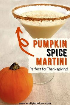 a pumpkin spice martini in a glass with an orange garnish