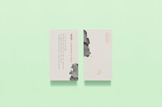 two business cards with chinese writing on them