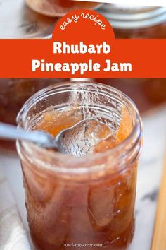 a glass jar filled with rhubarb pineapple jam on top of a table