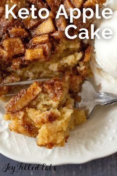 a close up of a plate of cake with ice cream on top and the words keto apple cake above it