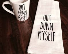 two tea towels with the words out dunn't mysele on them