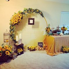 a table with sunflowers and other decorations on it