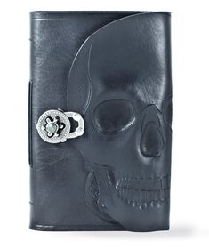 a skull with a ring on it's head is shown in this black leather wallet