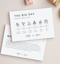 the big day wedding stationery is laid out on top of each other next to some flowers