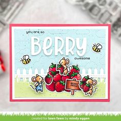 a card with the words berry on it and some stickers in front of it