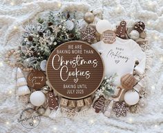 christmas cookies and baubles are arranged on a blanket