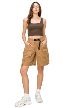 100% Cotton Feature: Experience the perfect blend of style and functionality with our low-rise waist and relaxed fit Bermuda shorts, featuring 9 pockets and an elastic waistband with a belt. Crafted from lightweight fabric, these effortlessly cool and comfortable shorts come in a natural color and offer a mid-rise, slouchy workwear look. Designed for both style and functionality, they are the ideal choice for a laid-back yet polished look during your work or leisure hours. Versatile Style: Pair Utility Bermuda Shorts With Built-in Shorts, Spring Sporty Cargo Shorts, Sporty Cargo Style Shorts For Summer, Spring Utility Cargo Shorts With Elastic Waistband, Sporty Cargo Shorts With Cargo Pockets For Spring, Sporty Summer Cargo Bottoms, Utility Bermuda Shorts With Cargo Pockets, Relaxed Fit Cargo Style Shorts For Summer, Utility Style Relaxed Fit Shorts