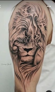 a man's arm with a lion tattoo on it, and his head is shown