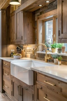 a kitchen with wooden cabinets and white counter tops, along with a large sink in the center