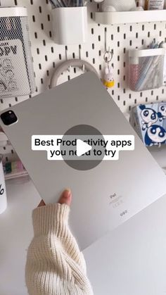 a person holding up a laptop computer with the text best prod - tity apps you need to try