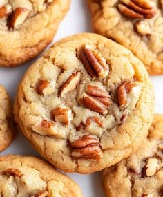 several cookies with pecans in the middle