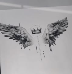 a black and white photo of two wings with a crown on it's back