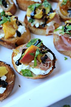 small appetizers are arranged on a white tray