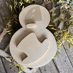 an odd shaped chair sitting on top of a wooden floor