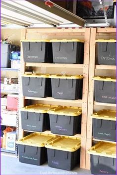 storage bins are stacked on wooden shelves in a store with the words christmas written on them