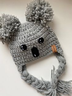 a crocheted hat with a pom - pom attached to it