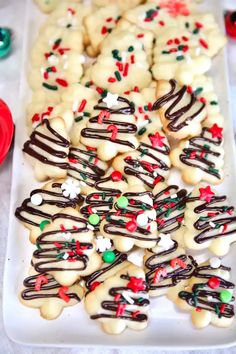 a white plate topped with cookies covered in frosting