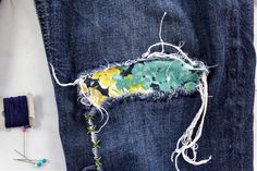 an old pair of jeans that has been torn down