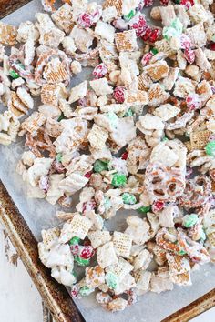 a tray full of christmas snack mix on top of a table