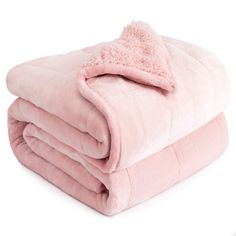 a pink blanket is folded on top of each other with a fluffy, fuzzy edge