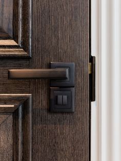 a door handle on a wooden door