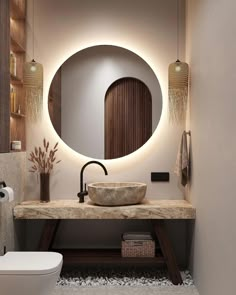 a bathroom with a round mirror above the sink