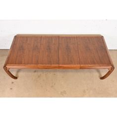 a wooden coffee table with two legs