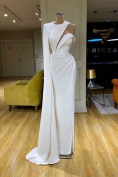 White Gala Dresses Long Sleeve, Luxury Asymmetrical One Shoulder Wedding Dress, Dresses By Valdrin Sahiti, White Gala Dresses With Sleeves, Luxury White Fitted One Shoulder Dress, Luxury White Dress With Back Zipper, Luxury White Maxi Dress With Sweep Train, Luxury Reception Dress With Asymmetrical Neckline, Luxury Fitted White One Shoulder Dress