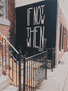 graffiti on the side of a building that says if not then? in black and white