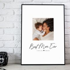 a photo frame with the words,'bath me ever'printed on it next to a camera