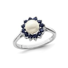 A classic round 6mm solitaire white pearl is surrounded by beautiful blue sapphire gemstones in this simple and affordable rhodium plated sterling silver ring. Freshwater Cultured Pearl Ring with Blue Sapphires in Sterling Silver Size: 7.  Gender: female.  Age Group: adult. Cultured Pearl Ring, Sapphire Gemstone, Pearl Ring, White Pearl, 1 Carat, Beautiful Blue, Pearl White, Rhodium Plated, Sterling Silver Ring