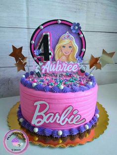 a pink and purple birthday cake with the number four on it, decorated with stars