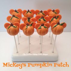 there are many orange pumpkins on the stick