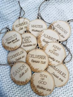 twelve wooden christmas ornaments with names on them