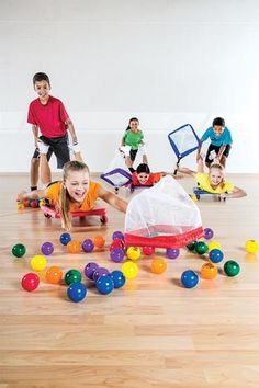 a group of children playing with toys on the floor