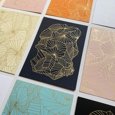 six different colored cards with gold foil designs on them